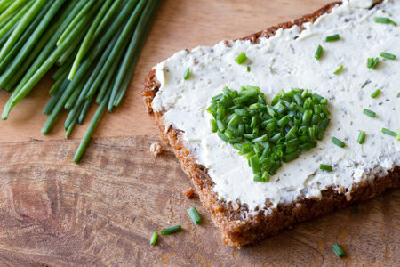 Sandwich with cream cheese and heart-shaped chives, conceptの写真素材