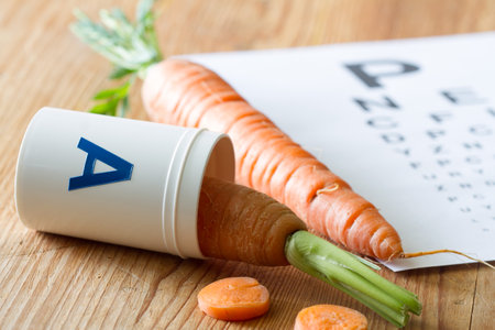 Carrot in vial of vitamin A, natural health for eyesight, conceptの写真素材