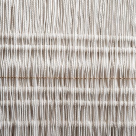 Close up of a white thread spool. Background and texture.の素材