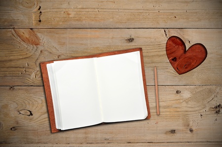 An open notebook with red heartの写真素材