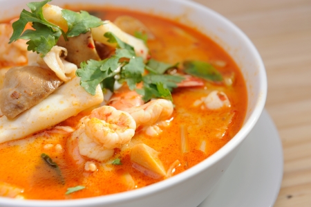 Tom Yum Goong in white bowl の写真素材