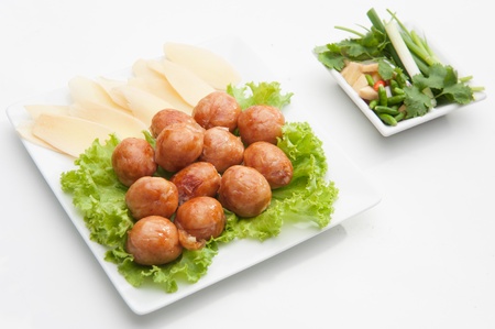 Thai traditional sausages served on white dishの写真素材