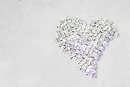 Cubes with letters of the English alphabet on a decorative backgroundの写真素材