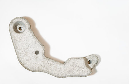 Fragment of a counterweight stone of a used washing machine