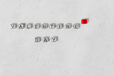 The inscription Valentine's day laid out in small letters on a decorative backgroundの写真素材