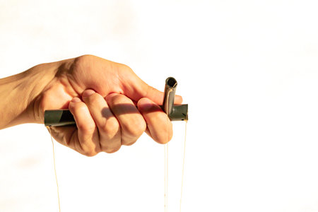 Fragment of the hand that manipulates the toy