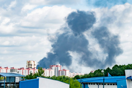 Black smoke from the fire in the city