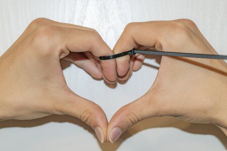 The fingers are compressed with the little plastic clampの写真素材