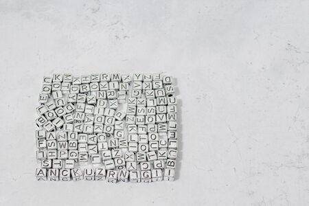 Cubes with letters of the English alphabet on a decorative backgroundの写真素材