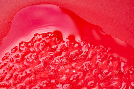 Melting ice on a red background
