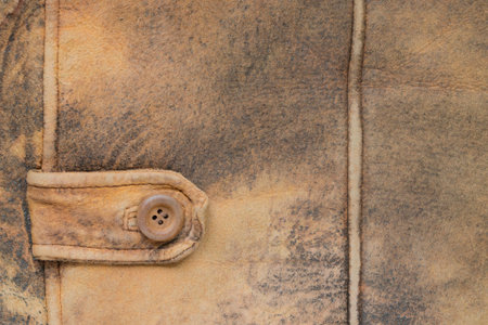 Fragment of a jacket made of brown suede leather