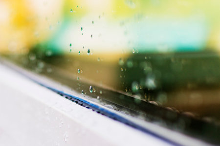 Drops on the glass of a plastic window after rain