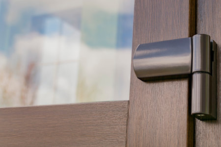 Fragment of a plastic door hinge during installation