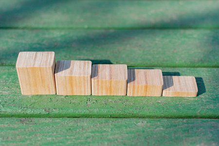 Collage of wooden blocks on a decorative background
