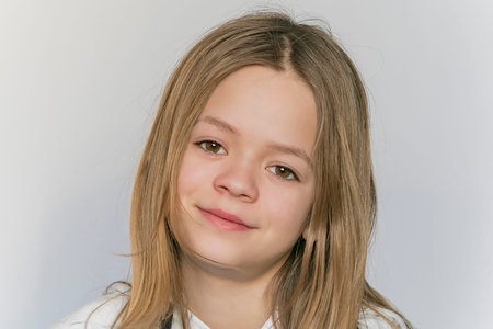 Young girl posing in front of the camera in the Studio