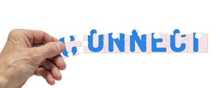 Collage of a man's hand and puzzles on a white backgroundの写真素材