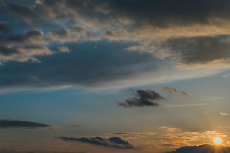 Frowning clouds in the evening sky at sunset