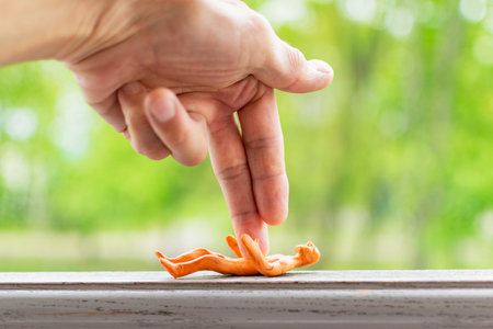 A little boy plays with a plasticine man