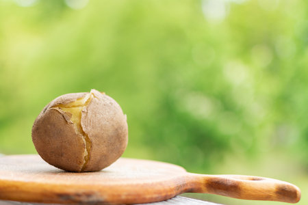 Boiled unpeeled potatoes on a cutting Board