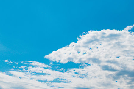 Bright white clouds in a blue Sunny sky