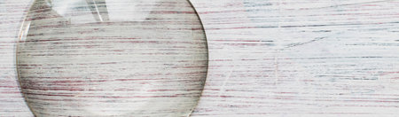 Magnifying glass on a decorative painted surfaceの写真素材