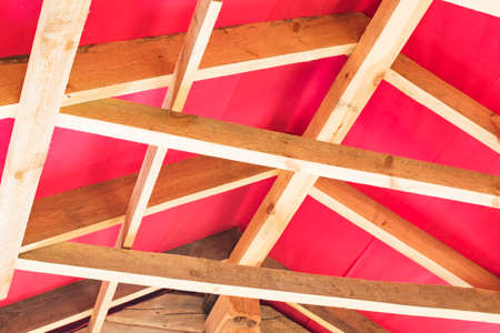 Fragment of a house under construction made of wooden beamsの写真素材