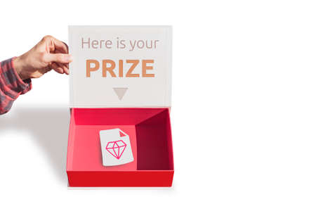 Concept collage of a packaging box a man's Hand holds an open empty gift boxの写真素材