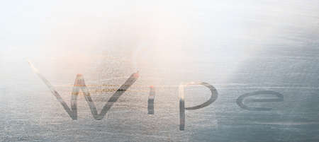 The inscription on the fogged glass on a cool morning, wipe, wipe meの写真素材