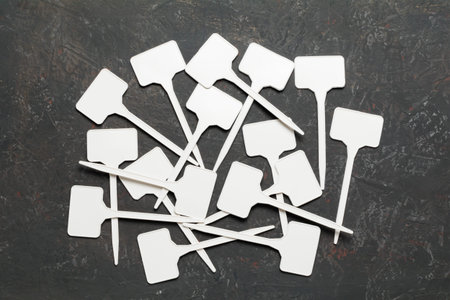 Collage of small white plastic signs on a decorative background