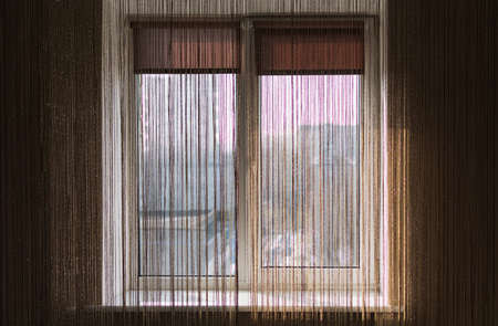 Decorative tulle and curtains on the bedroom windowの写真素材
