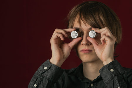 Collage of images of a young guy and metal rollers on a dark background