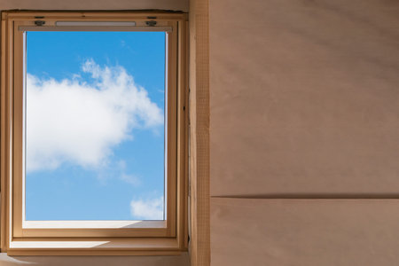 Fragment of an attic window in a new house under construction