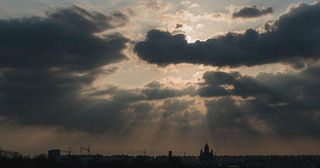 Dark gloomy clouds over the city during sunset