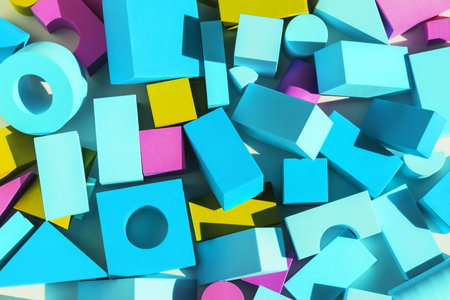 Collage of geometric shapes made of foam rubber in different colors