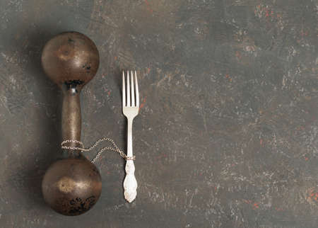 The fork is tied to the load on a decorative backgroundの写真素材