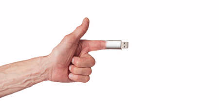 Collage, a man's hand holding a flash drive on a white backgroundの写真素材