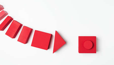 Collage of geometric shapes made of foam rubber in the form of a start button and an arrowの写真素材