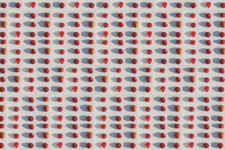 Texture image of red strawberries on a white background