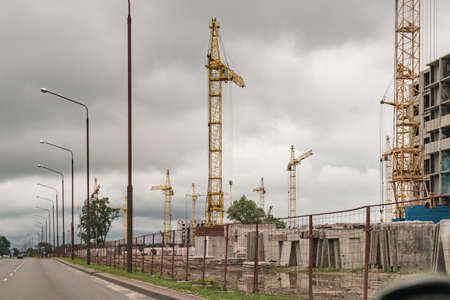 Tower cranes on a large construction site in the new city districtの写真素材