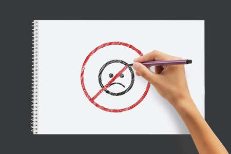 A little boy draws antidepressant drawings in an albumの写真素材