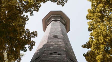 High ancient brick chimney with panoramic view in the parkの写真素材