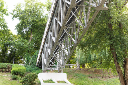 Bottom view of the metal pedestrian bridge in the park