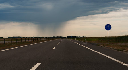 Rain clouds over a new highway outside the city