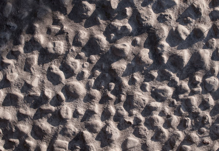 Textural image of a wall made of concrete and small stoneの写真素材