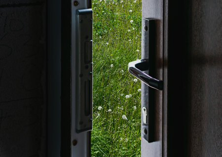 A fragment of a new plastic door with a handle covered with lamination
