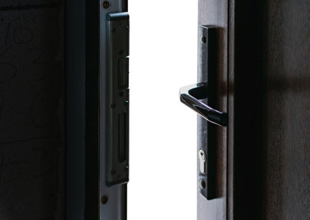A fragment of a new plastic door with a handle covered with lamination