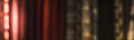 A blurry image of a counter in a store with curtains and tulle in a large assortmentの写真素材