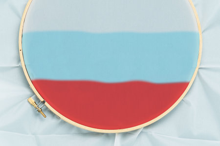 Embroidery hoop with white canvas