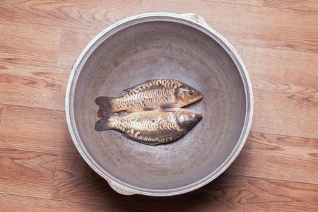 View of fresh fish river carp in a large metal panの写真素材