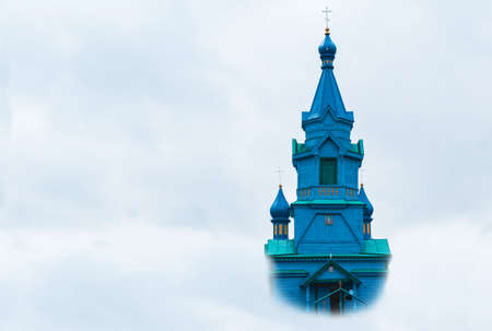 Image of an old church shrouded in cloudsの写真素材